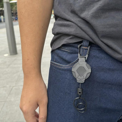 Carrete Aferra enganchado a la correa de una cartera